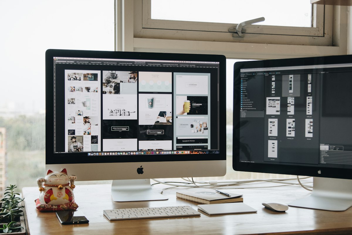 Developer maintaining a website on two monitors – 6 Months plan
